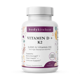 A bottle of Body Kitchen Vitamin D + K2 supplement with 60 capsules, featuring 5000 IU of Vitamin D3 and 180 mcg of K2. The label highlights bone strength, heart health, and immune support.