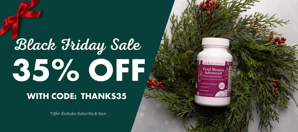 Black Friday sale advertisement with a bottle of supplements and a wreath on a green background.